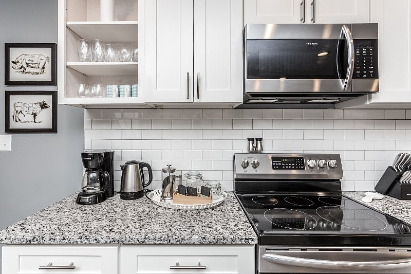 Full kitchen compliment of cookware, glassware, dishwasher and silverware.