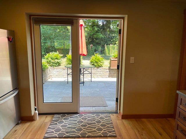 These french doors have privacy curtains.