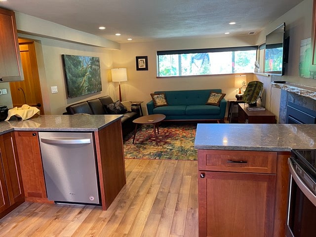 Brand new midcentury modern decor. Privacy shades included on these windows or enjoy the view of the front yard greenery.