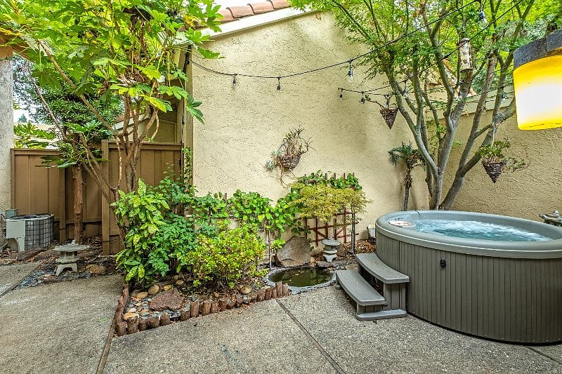 Enjoy the relaxing tranquility in your private backyard patio while simmering in the 15 jet/ multi-light Hot Tub.