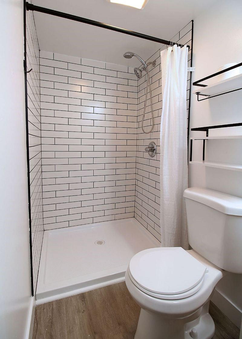 Bath 1 - standing tiled shower w/ double/removable shower head