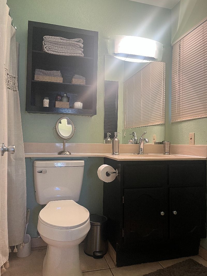 Private full bathroom connected to the first bedroom.
