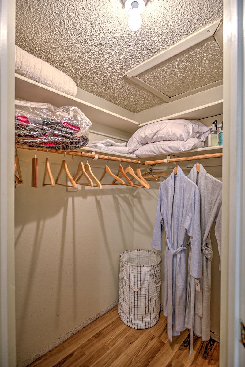 Main bedroom featuring a spacious walk-in closet.