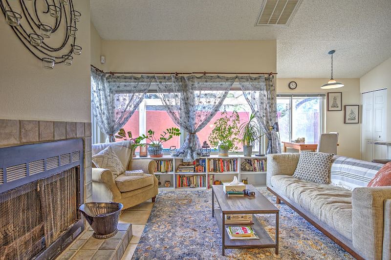 Sunlight pours in through walls of windows, brightening the space.