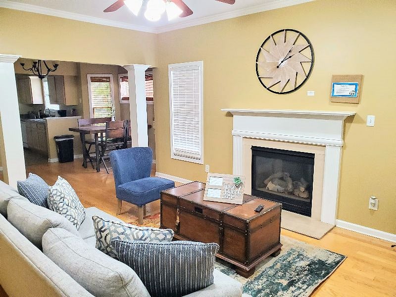 Open floor plan, living room includes TV. Fire place is non-functional