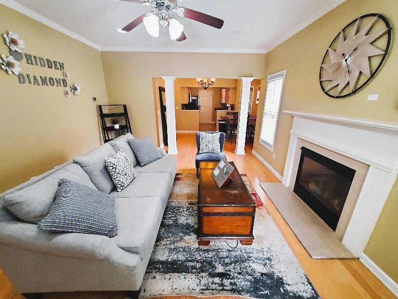 Open floor plan, living room includes TV. Fire place is non-functional