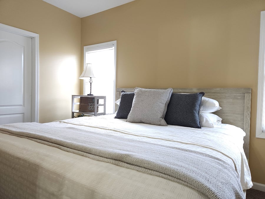 Primary bedroom, king bed, sleeps two, ceiling fan, connected bathroom