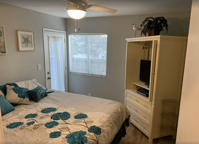 Master Bedroom King Bed w door leading to back patio