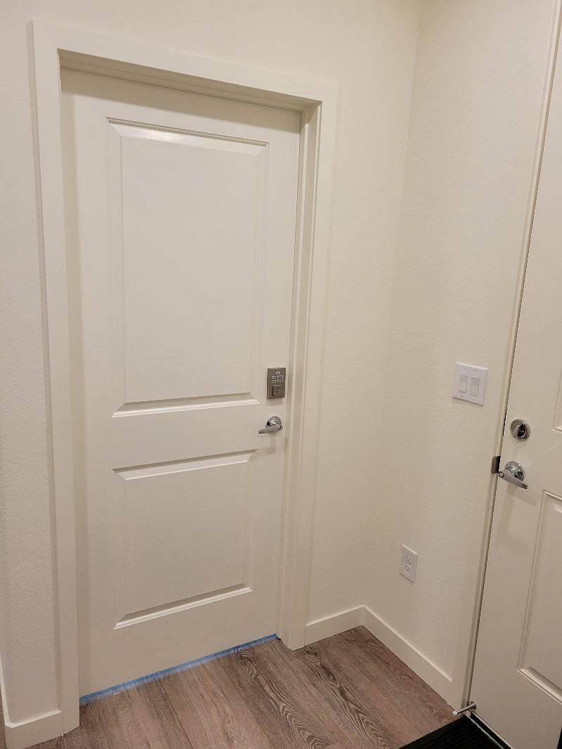 Solid core doors lead to master suite with keypad deadbolt for maximum security