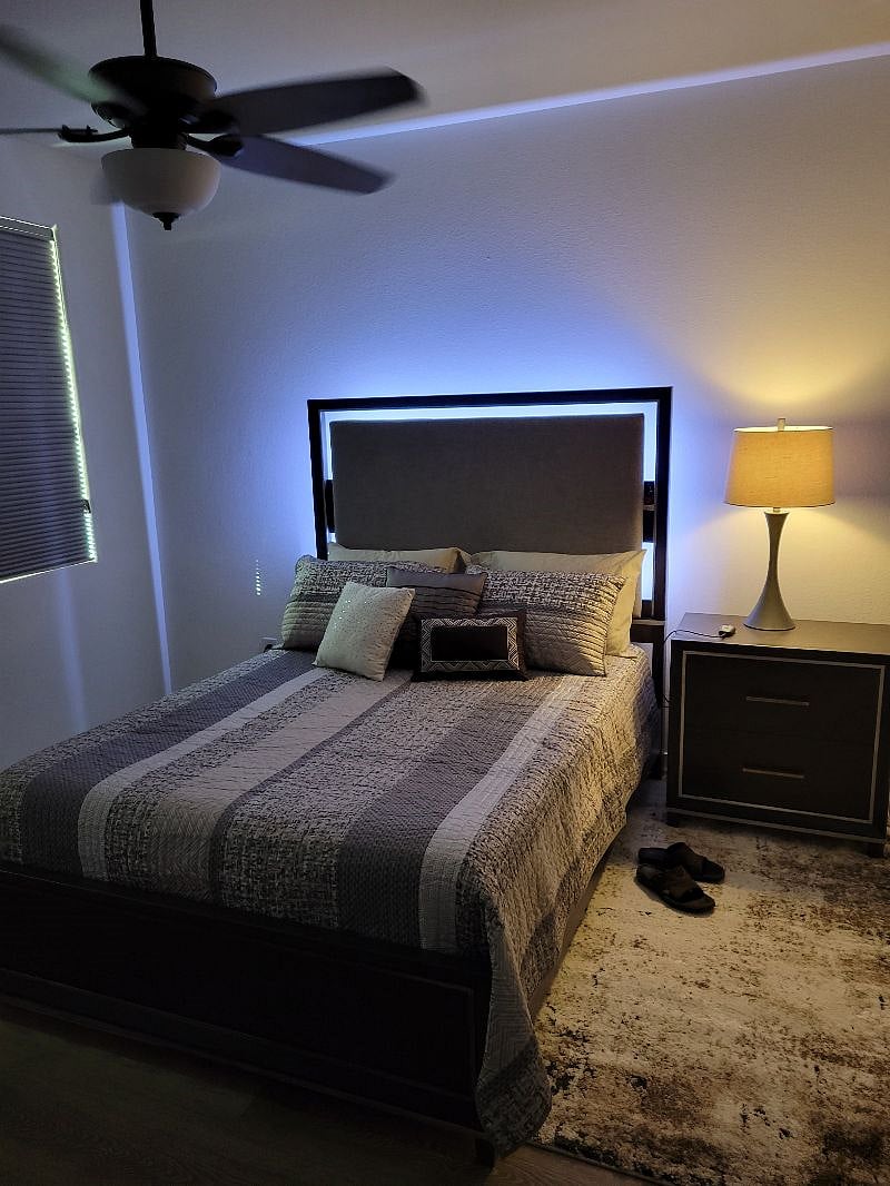 Downstairs queen bed with blackout window coverings. Individual thermostat for bedroom with ceiling fan for maximum comfort