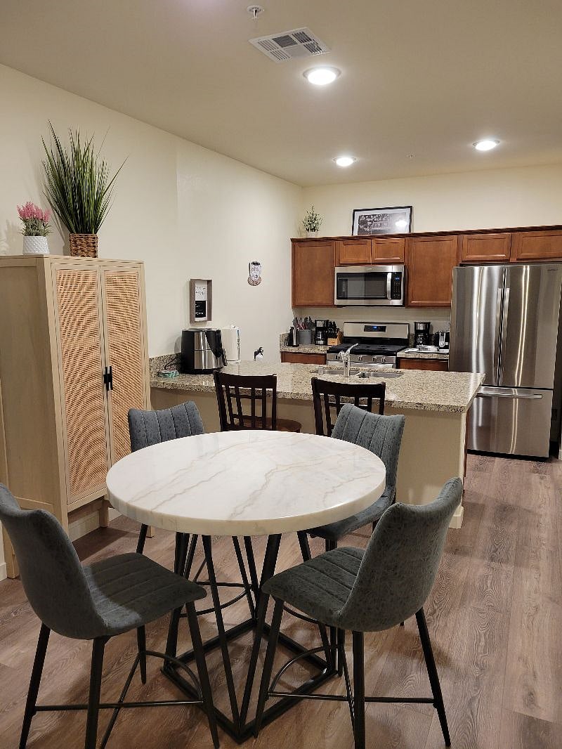 Dining and kitchen area with pantry cabinet.