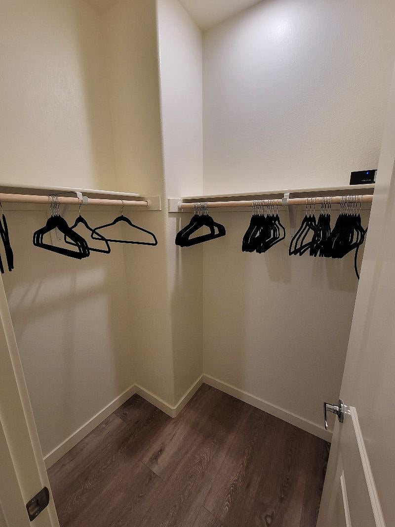 Walk in closet off of in suite bathroom
