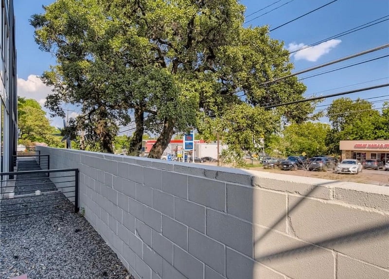 Sliding door access to the patio and a Ring security camera. Beautiful Heritage Oak tree.