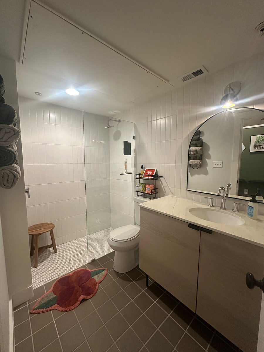 Rain shower and teak stool.