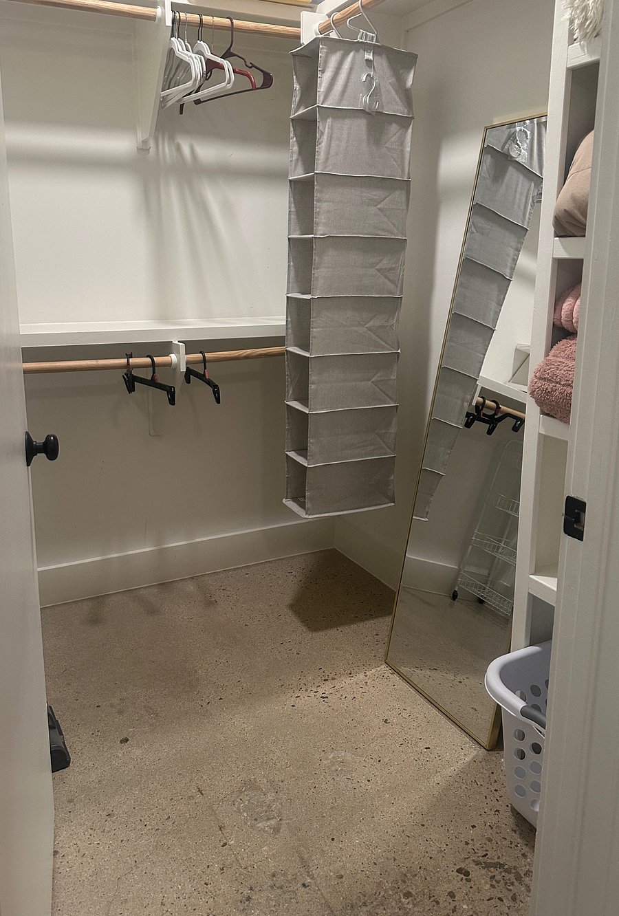 Large walk in closet with extra blankets.