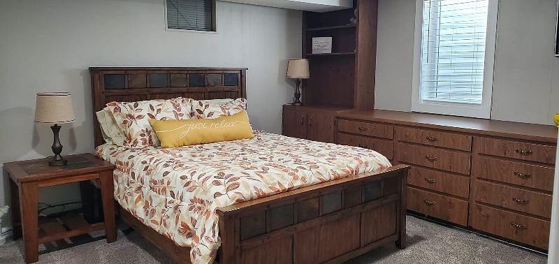 Queen sized bed with 6 standard pillows and two sheet sets