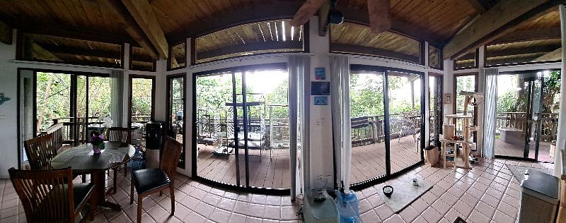 Panorama shot of the inside with wrap around windows (just had them all cleaned!)- you can see my bird cages on the deck