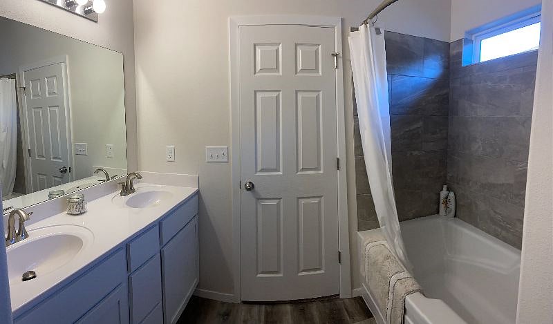 en suite bathroom with deep soak tub
