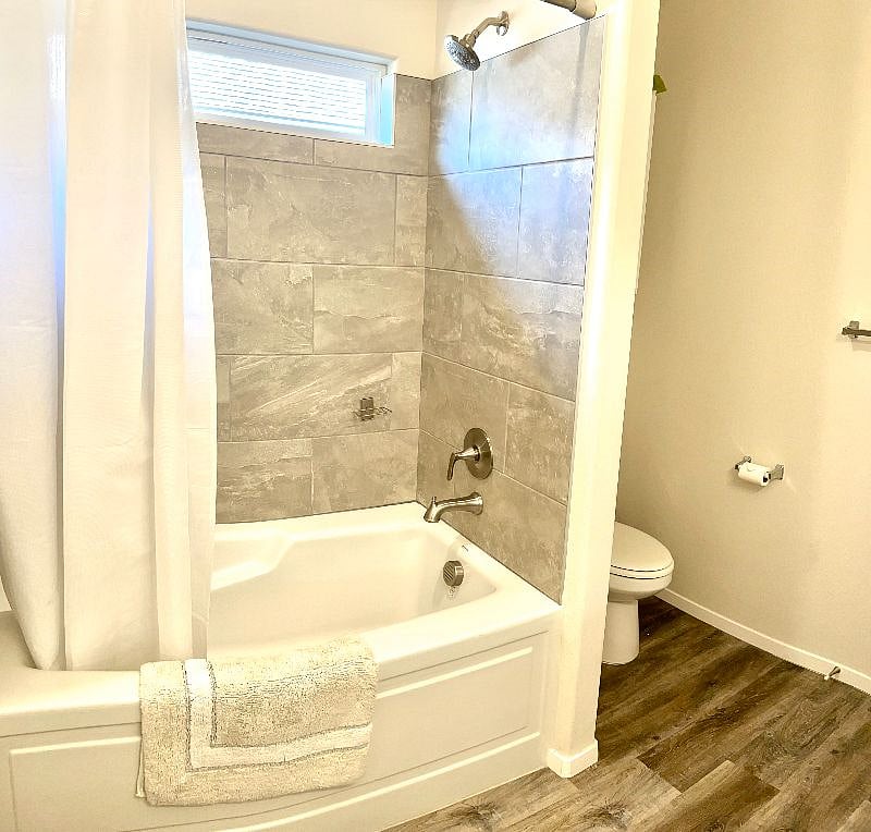 en suite bathroom with deep soak tub