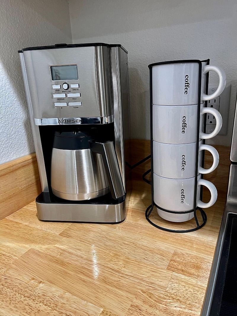 You will have a brand-new Coffee maker and mugs.