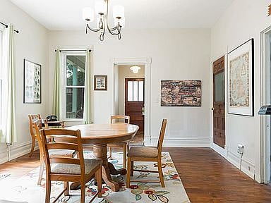Dining room looking from kitchen towards front of house.