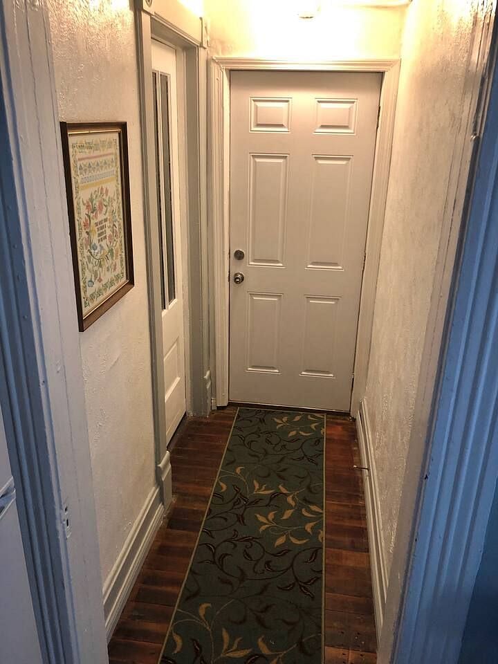 Backdoor (master bedroom to the left) leading to 1 stall garage.