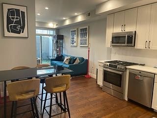 Open concept kitchen and dining room combination.