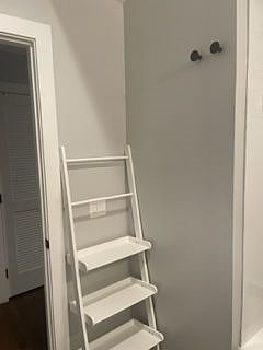 Bathroom with open shelves' storage.
