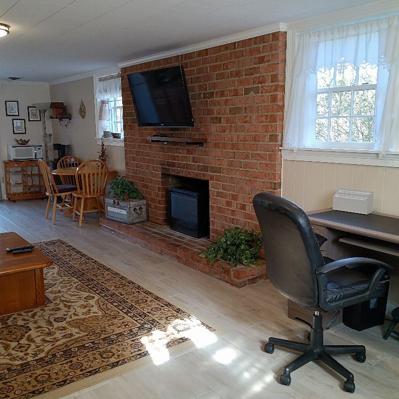 Electric fireplace with heater keeps you toasty on cool evenings.