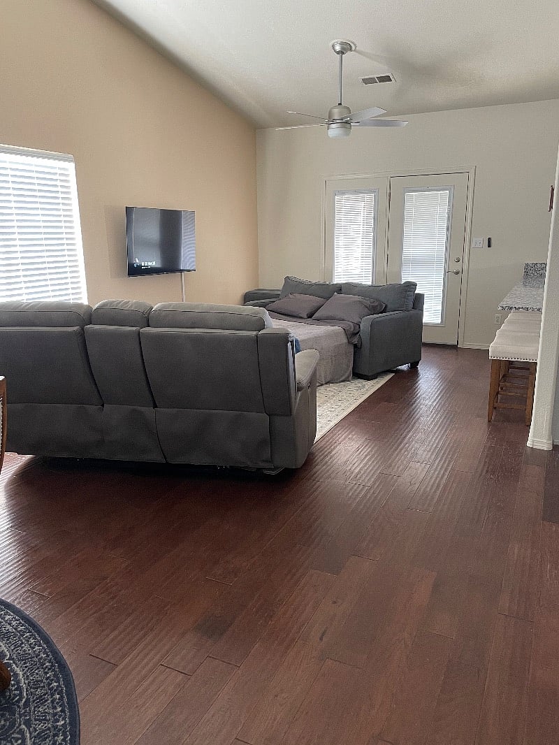 Living Area with sofa bed, double recliner, and Smart TV 
