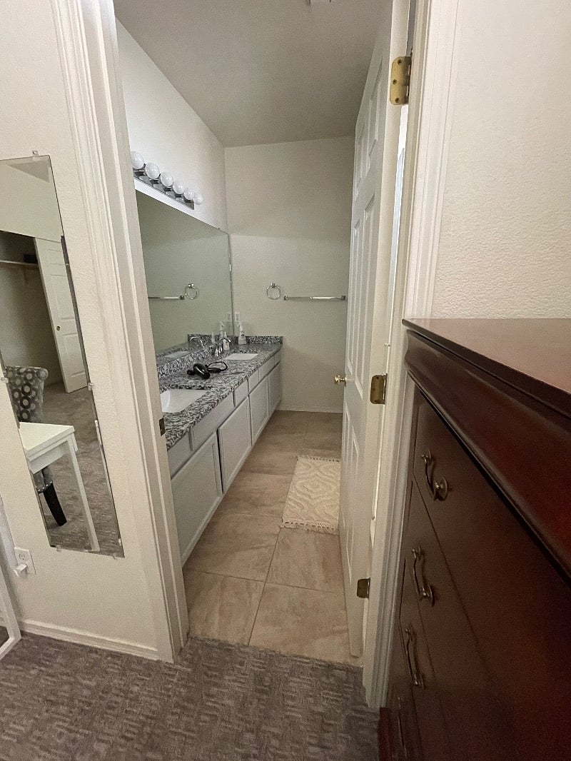 Master Bathroom. 2 sinks, Large Walk-in Shower, toilet, blow dryer, magnifying mirror.