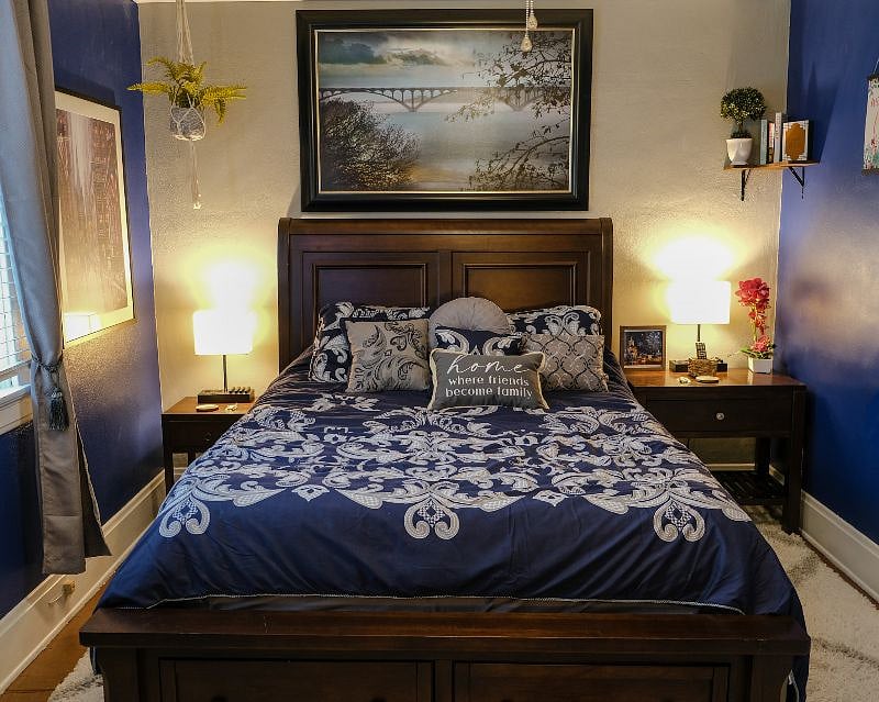 Queen size mattress with charging lamps located on either side of the bed.