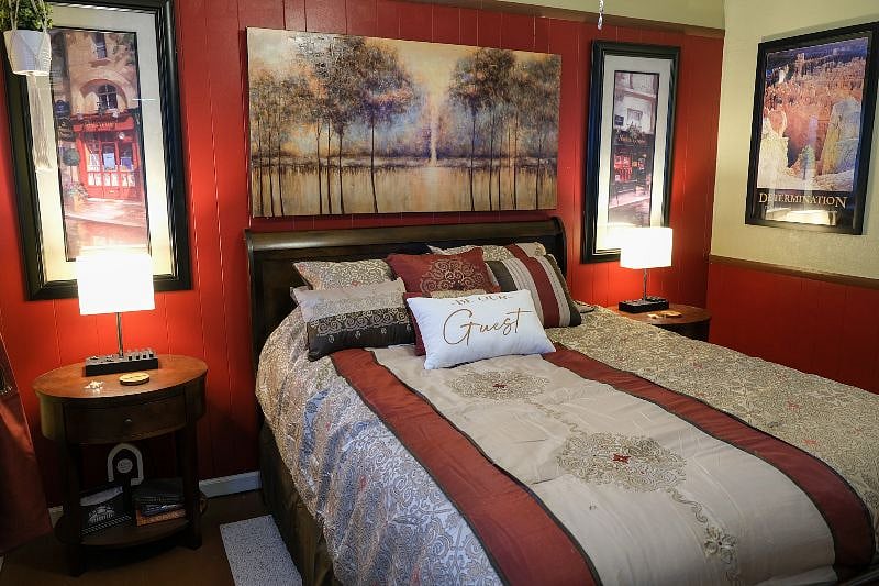 Queen size mattress with charging lamps located on either side of the bed.