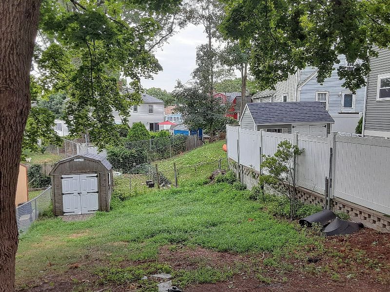 Back yard seen from back door (needed mowing)