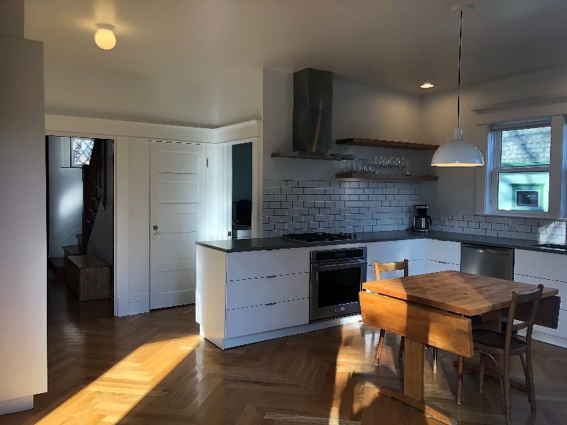 Kitchen, first floor bathroom in open door behind counter