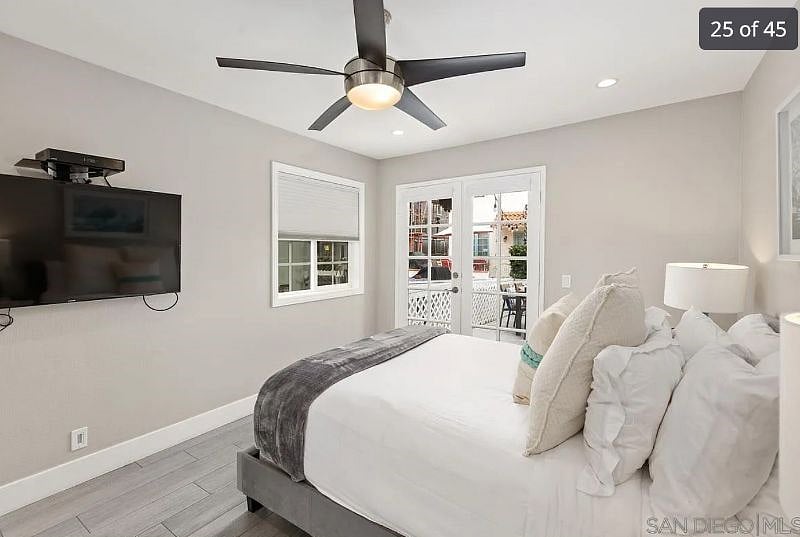 Queen (bedroom 1) with Smart TV and Mini-split system in room.