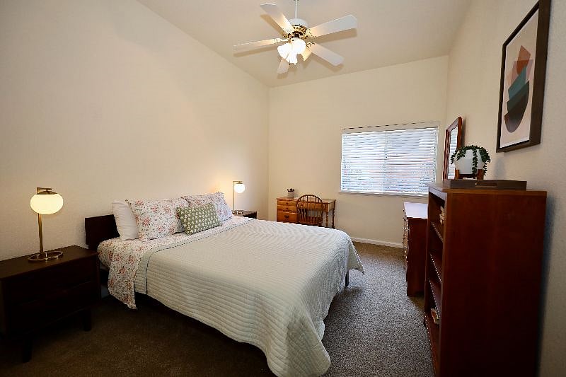Bedroom 2 with Queen bed, closet, dresser, bookshelf, desk