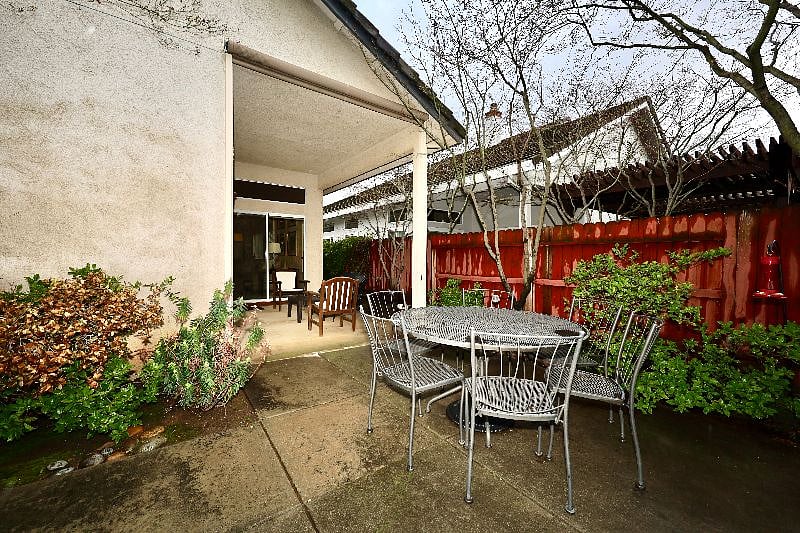 Large backyard, dining table, shaded seating area