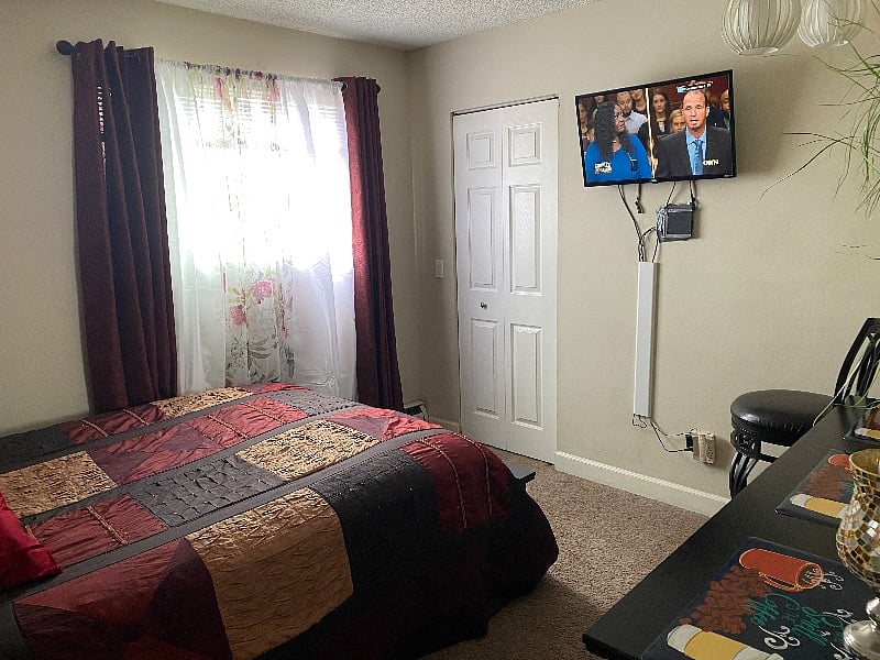 This is your PRIVATE BEDROOMw/ flat screen TV mounted on the wall 6 draw dresser Queen size bed light fixture lamp ready for a good night sleep
Drapery and blinds at the window.what are you waiting for.????