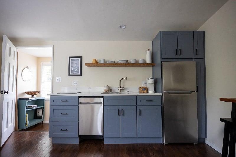 Kitchenette with fridge/freezer, induction cook top, microwave, Keurig coffee maker, tea pot, pots/pans, etc.