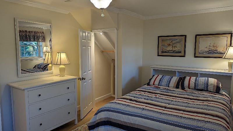 Terrace level bedroom closet with light