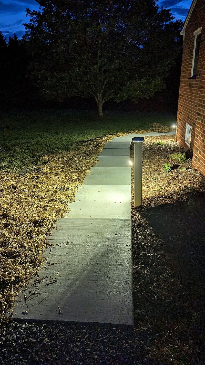 Well lighted sidewalk to deck and terrace level entrance