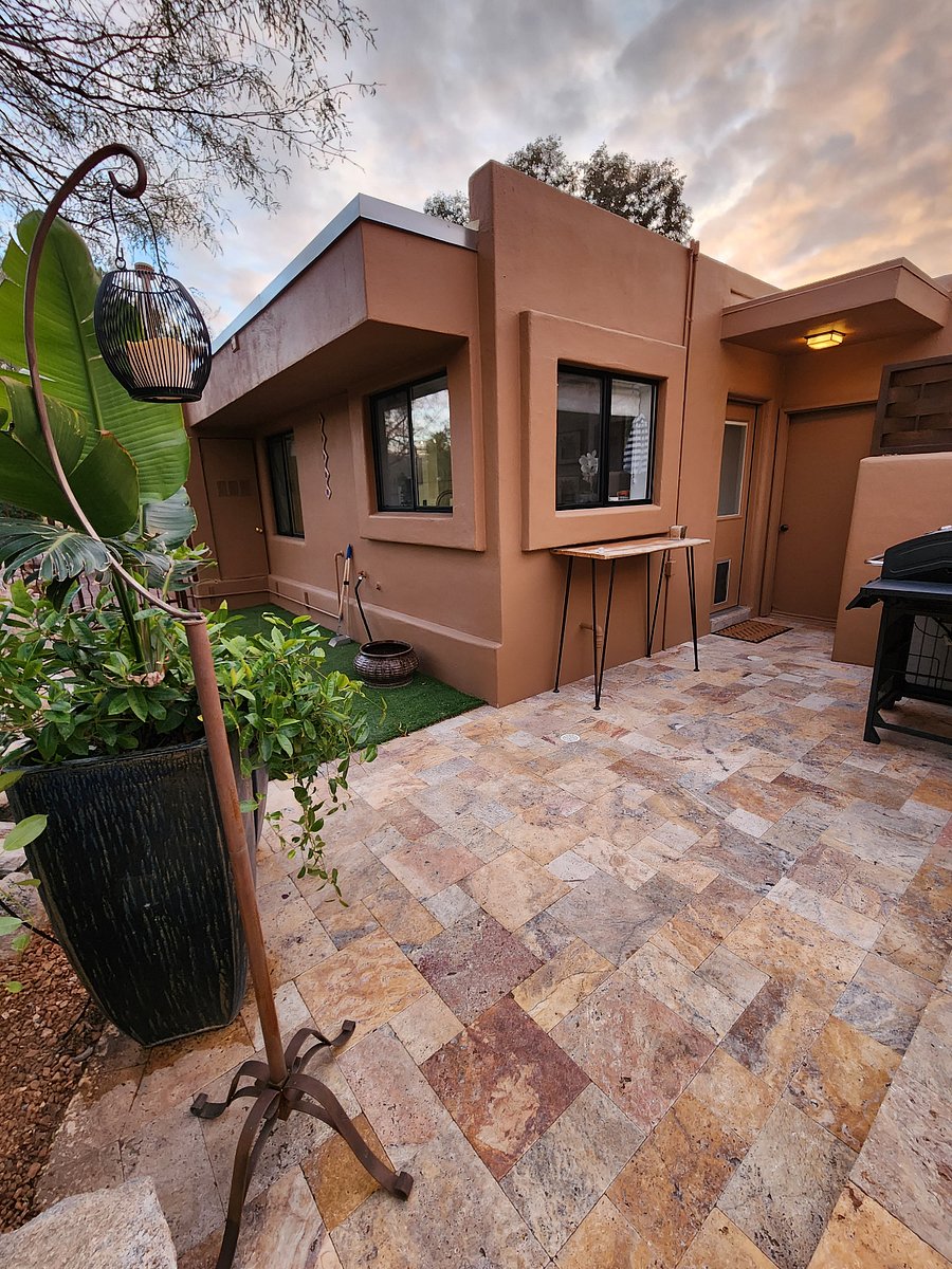 Turf area for dogs and BBQ by back door and kitchen windows
