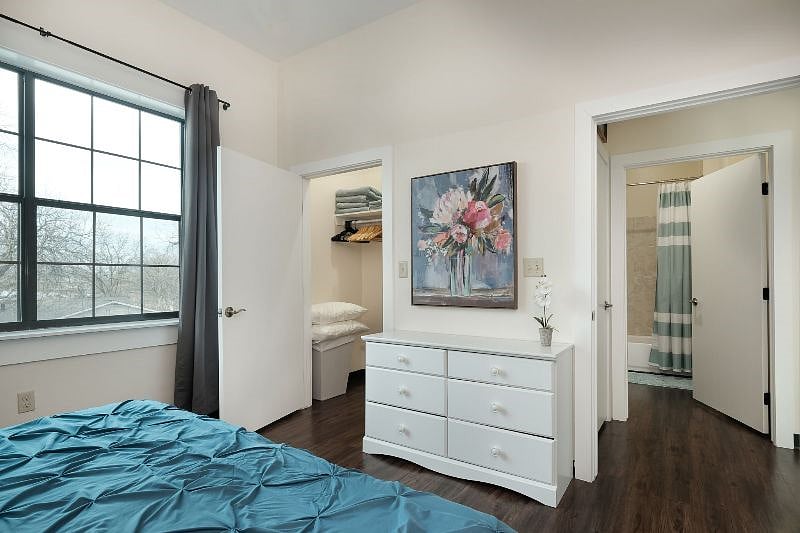 Bedroom #2: King bed with luxury bedding, blackout curtains, dresser and closet with lots of hanging space. Bed can be converted to two twin beds upon request. Bathroom right outside the bedroom.
