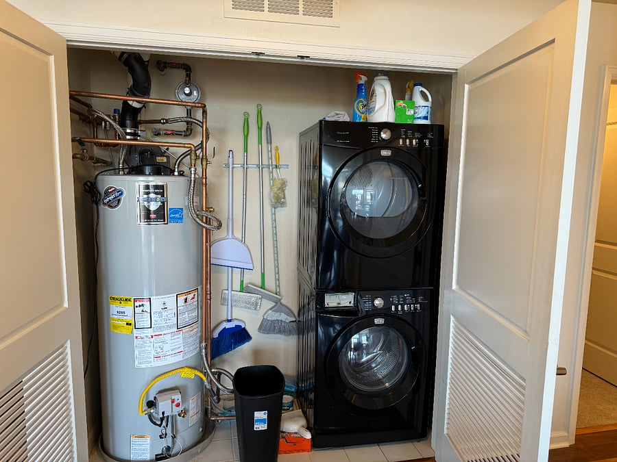 Utility closet including washer/dryer and large hot water heater
