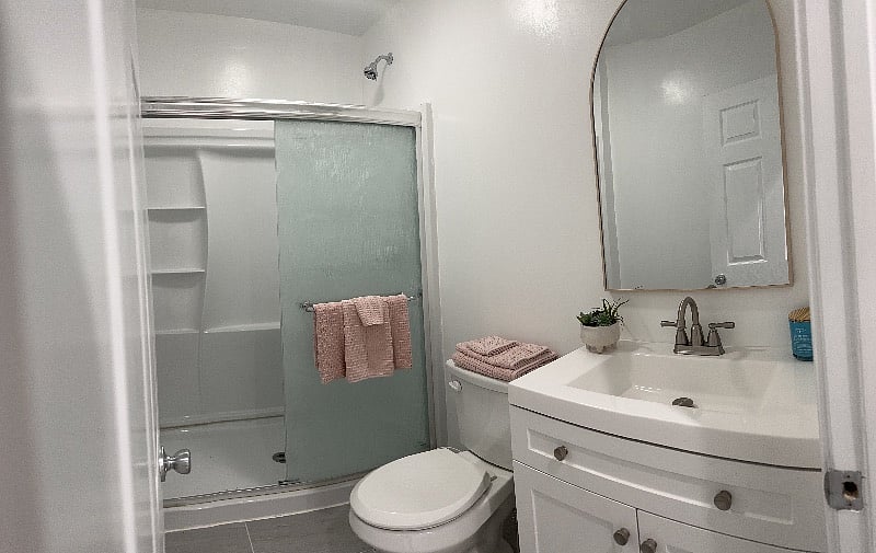 The bathroom is stocked with one set of bath towels as well as a complimentary starter supply of toilet paper.