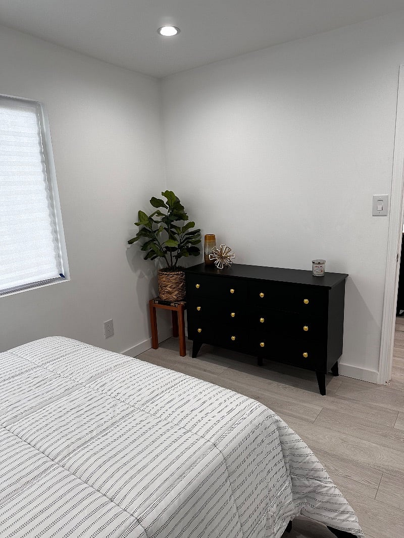 The bedroom is also outfitted with a sleek and modern 6 drawer dresser.  