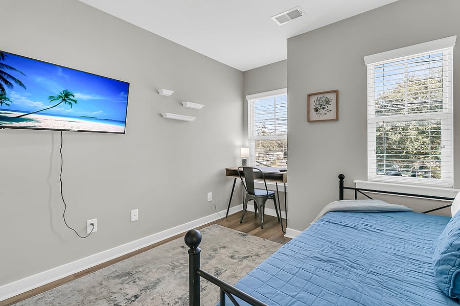 Bedroom #3 features a twin daybed with trundle, closet, and smart TV - perfect for children or additional guests. There's also a desk for your work-from-home or study needs!