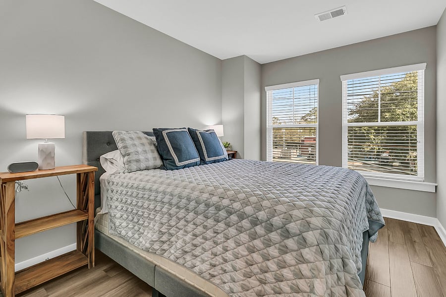 Bedroom #2 is furnished with a queen-sized bed and closet for clothing storage