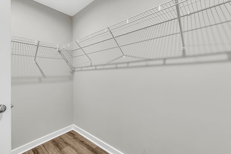 Bedroom #1, the primary suite, includes a king-sized bed, large closet, smart TV, and an en-suite bath with a spacious walk-in shower.